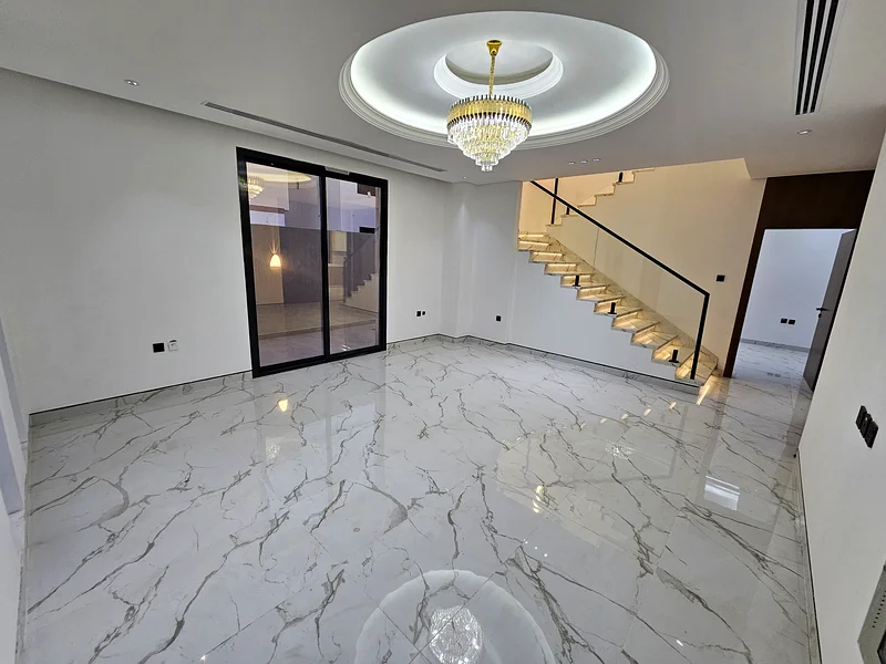 Villa for sale in Ajman, Al Helio 2 area, including registration and ownership fees, consisting of 4 master bedrooms with a swimming pool, freehold fo63909552278145114