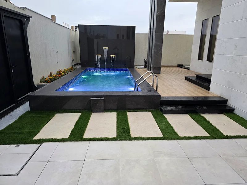 Villa for sale in Ajman, Al Helio 2 area, including registration and ownership fees, consisting of 4 master bedrooms with a swimming pool, freehold fo63909552278145113