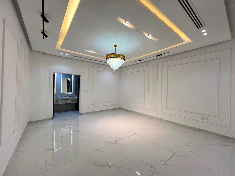 Corner villa for sale in Ajman, Al Helio 2 area, including registration fees, consisting of 4 master bedrooms, a majlis, a hall, and a large setback o63909006056705114