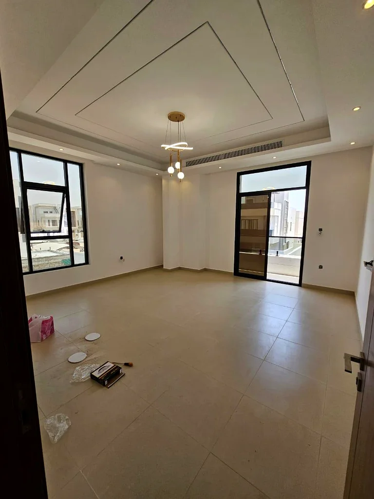 Villa for sale in Ajman, Al Bahia area, including central air conditioning, consisting of 5 master bedrooms, a living room, a hall, and indoor and out63883087795457114