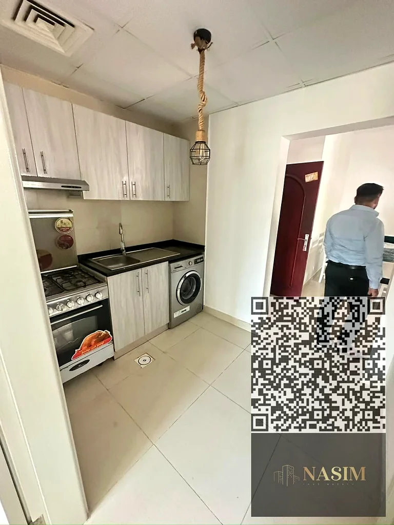 شقة بغرفة نوم واحدة وغرفة معيشة للإيجار في الرشيدية 2 – خلف أبراج الفالكون63721701077634114