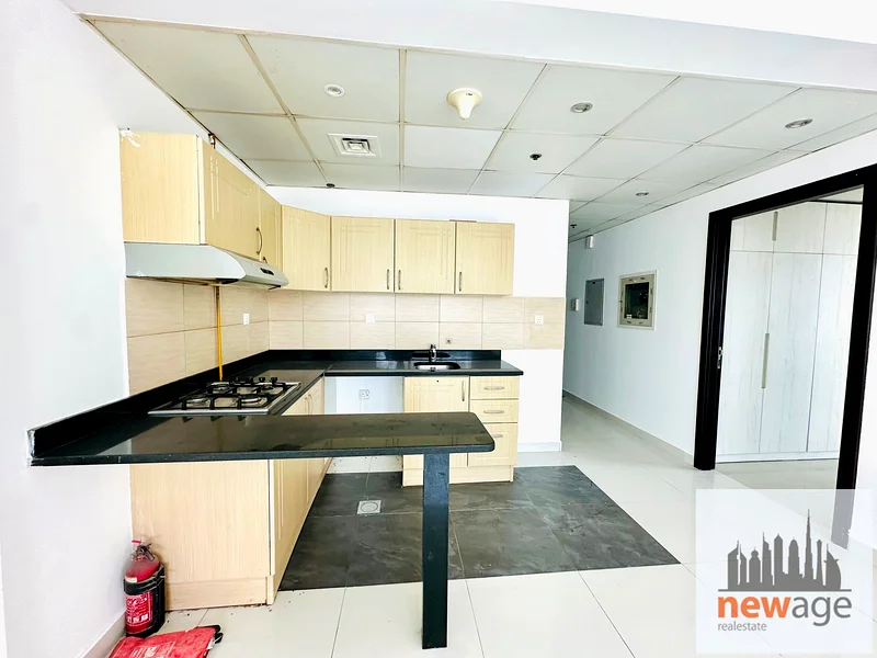 شقة كبيرة بغرفة نوم واحدة للإيجار في مدينة دبي الرياضية63735205977731114