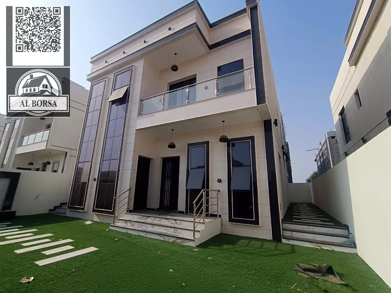 For sale, a villa in Al Helio 2, Ajman, consisting of 3 bedrooms, a hall, a majlis, and a maid’s ro63911404093955111