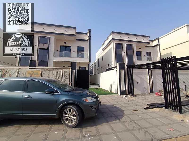 For sale, a villa in Al Helio 2, Ajman, consisting of 3 bedrooms, a hall, a majlis, and a maid’s ro63911404093955110