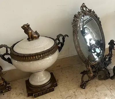 Pair Antique bronze mirror table stand with a white porcelain and bronze vase