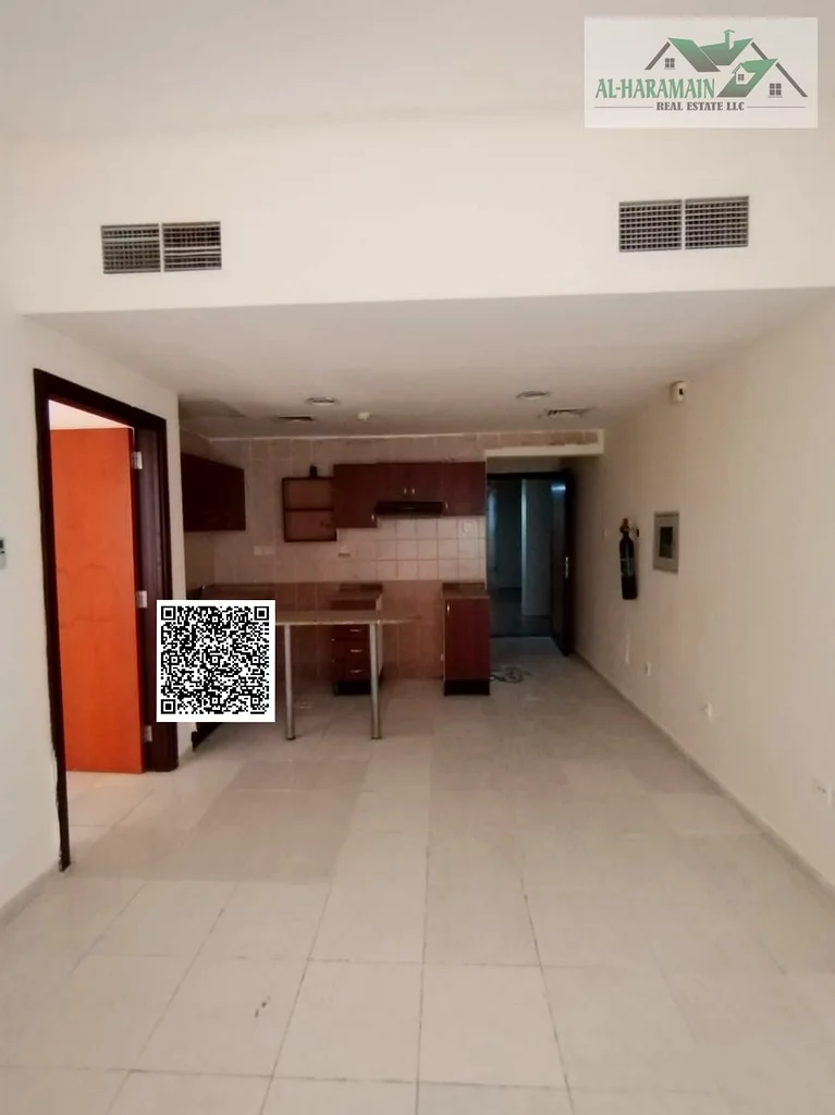 ONE BEDROOM FOR RENT IN GARDEN CITY  TOWER OPEN KITCHEN WITH PARKING ONLY 24000/- AED YEARLY63708147697153111