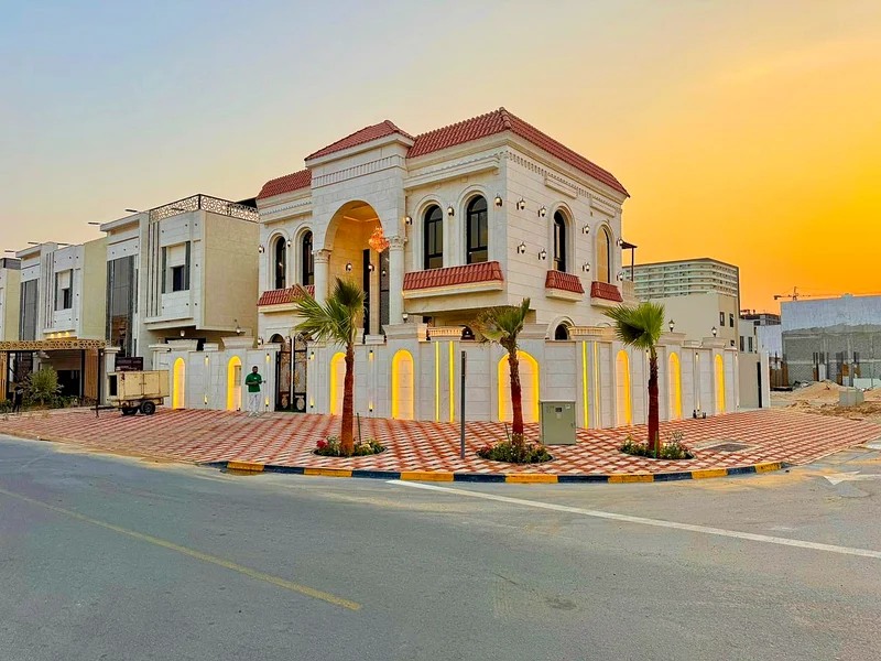 Corner villa for sale in Ajman, Al Helio 2 area, consisting of 5 master bedrooms, a living room, and a large setback outside the villa. Freehold for a63909983169539111