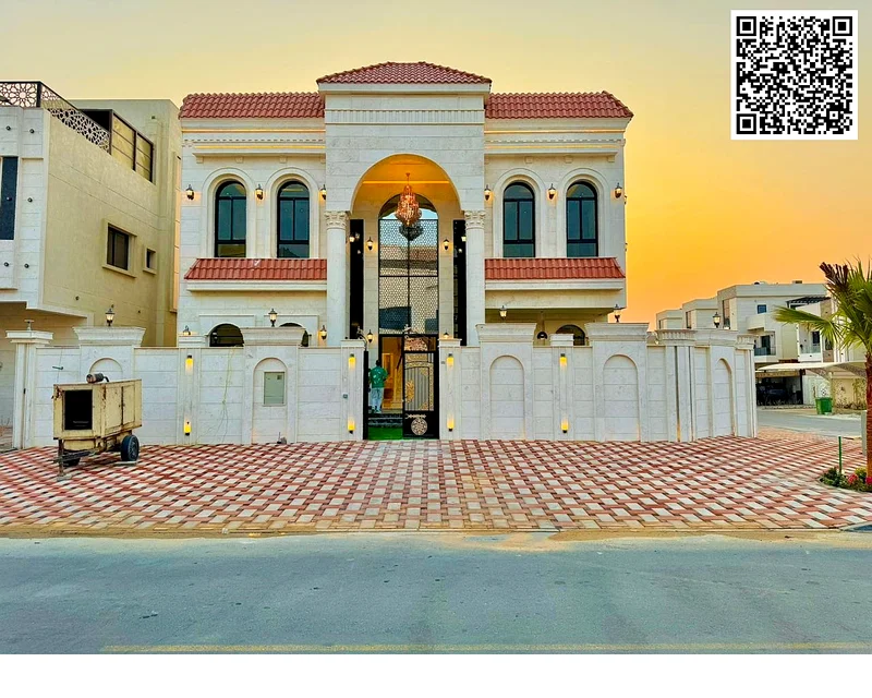 Corner villa for sale in Ajman, Al Helio 2 area, consisting of 5 master bedrooms, a living room, and a large setback outside the villa. Freehold for a63909983169539110