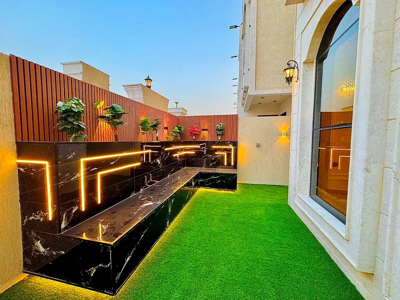 Corner villa for sale in Ajman, Al Helio 2 area, consisting of 5 master bedrooms, a living room, and a large setback outside the villa. Freehold for a63909983169539113