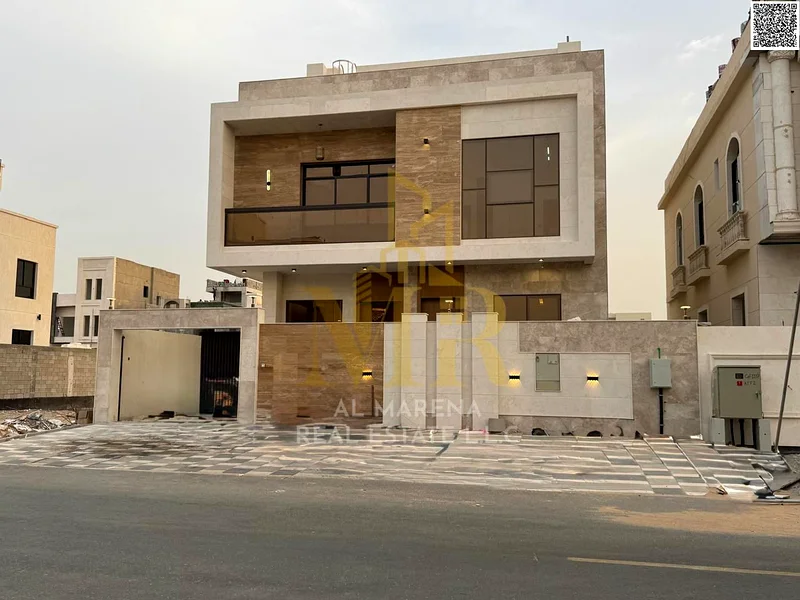 A villa with a price including registration and ownership fees on the main street, ready for occupancy in the most upscale areas of Ajman, freehold fo63883873964801111