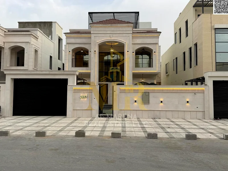 For sale, a luxurious villa in Al Bahia - Ajman | Two floors + roof | 5 master bedrooms + majlis + 2 halls + front yard + roof seating area | Land are63883873956482114