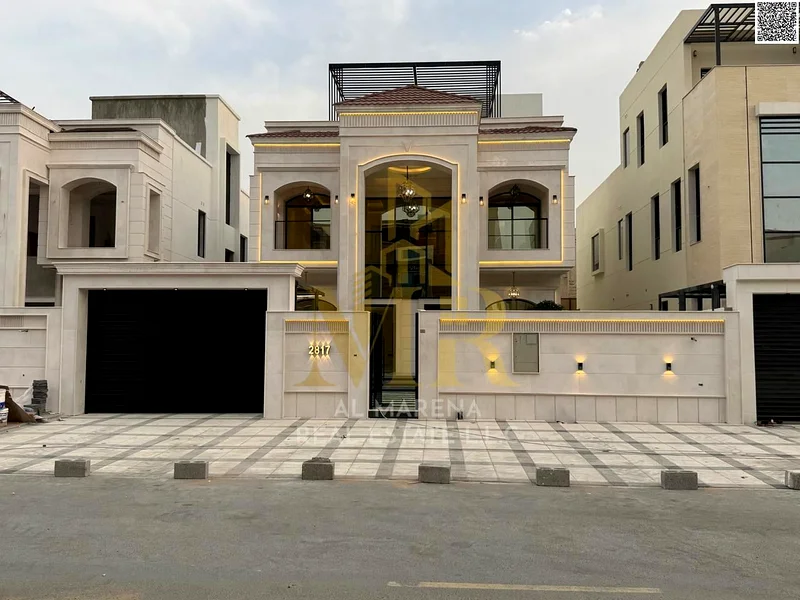 For sale, a luxurious villa in Al Bahia - Ajman | Two floors + roof | 5 master bedrooms + majlis + 2 halls + front yard + roof seating area | Land are63883873956482113