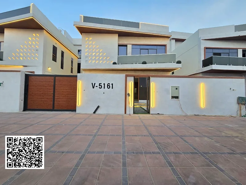 Villa for sale in Ajman, Al Helio 2 area, including registration and ownership fees, consisting of 5 master bedrooms with a majlis, a hall, and a maid63910418063746110