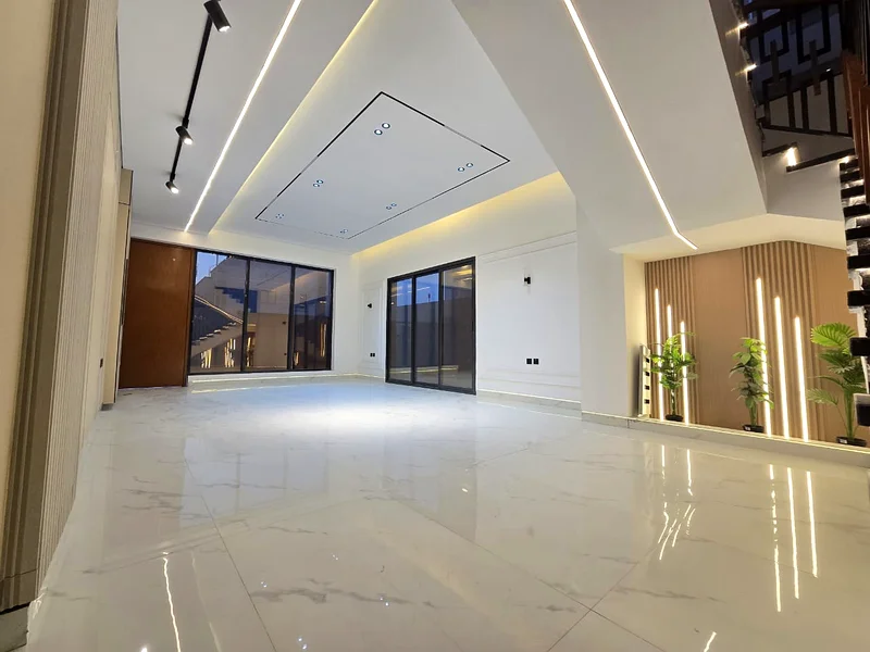 Villa for sale in Ajman, Al Helio 2 area, including registration and ownership fees, consisting of 5 master bedrooms with a majlis, a hall, and a maid63910418063746113