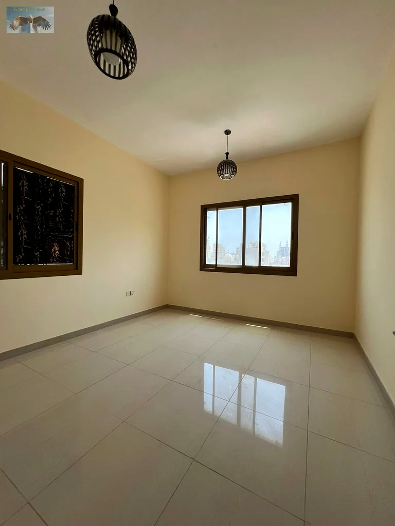 One bedroom and a hall with a balcony, excellent finishing, for annual rent in the Corniche in Ajman, close to all services, a distinguished location63810439130882114