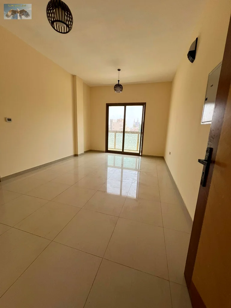 One bedroom and a hall with a balcony, excellent finishing, for annual rent in the Corniche in Ajman, close to all services, a distinguished location63810439130882113