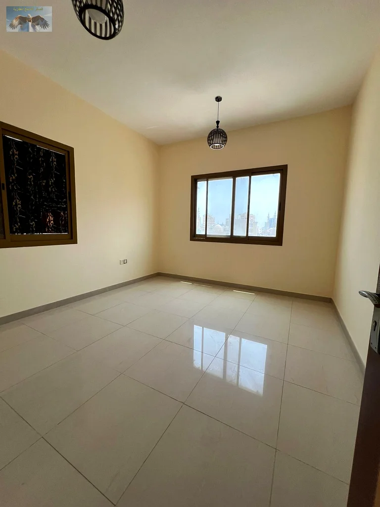 One bedroom and a hall with a balcony, excellent finishing, for annual rent in the Corniche in Ajman, close to all services, a distinguished location63810439130882111