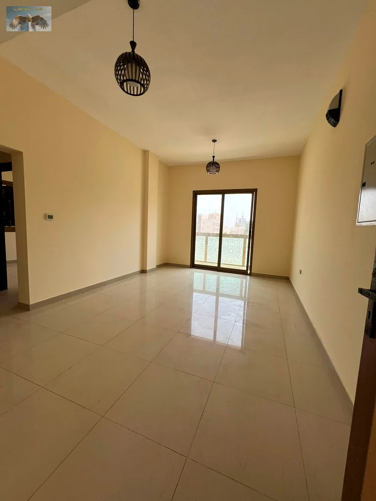One bedroom and a hall with a balcony, excellent finishing, for annual rent in the Corniche in Ajman, close to all services, a distinguished location63810439130882112