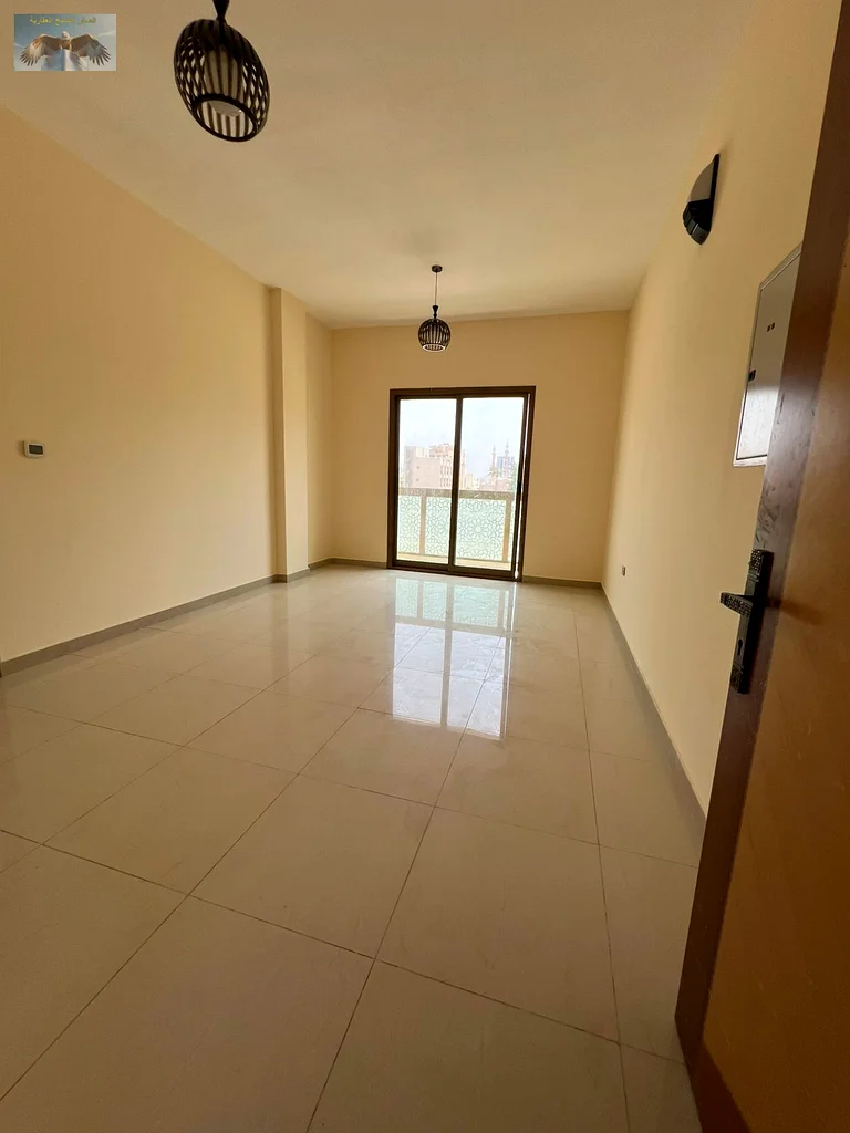 One bedroom and a hall with a balcony, excellent finishing, for annual rent in the Corniche in Ajman, close to all services, a distinguished location63810439130882110