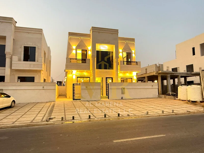 5-room villa with a classic design, a prime location on a main street in Al Helio 2, Ajman, including registration fees and electricity, bank financin63911730008962112