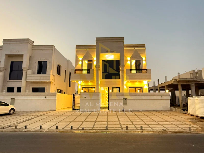 5-room villa with a classic design, a prime location on a main street in Al Helio 2, Ajman, including registration fees and electricity, bank financin63911730008962110