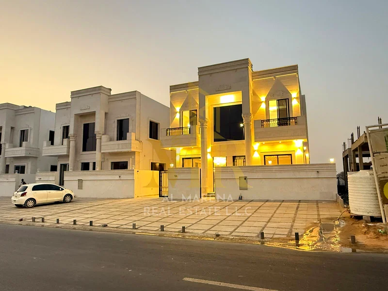5-room villa with a classic design, a prime location on a main street in Al Helio 2, Ajman, including registration fees and electricity, bank financin63911730008962111