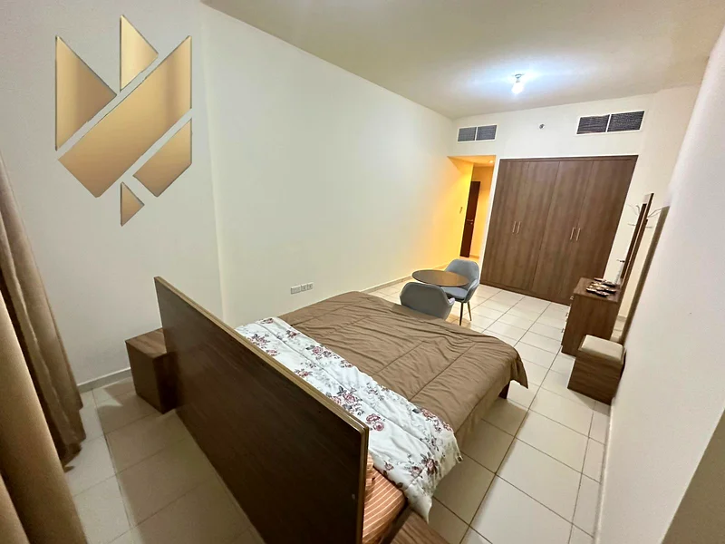 Two-bedroom apartment for sale in Ajman One Tower - city and garden view63866308067842114