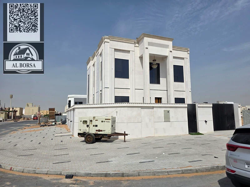🏡 For sale, a corner villa in Al Helio 2, Ajman, 4 master bedrooms, a majlis, a hall, and all rooms are equipped with built-in wardrobes, at an attra63911300368897110