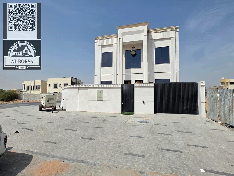 🏡 For sale, a corner villa in Al Helio 2, Ajman, 4 master bedrooms, a majlis, a hall, and all rooms are equipped with built-in wardrobes, at an attra63911300368897113