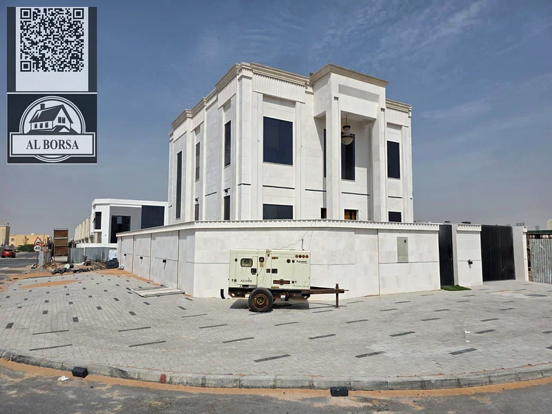 🏡 For sale, a corner villa in Al Helio 2, Ajman, 4 master bedrooms, a majlis, a hall, and all rooms are equipped with built-in wardrobes, at an attra63911300368897112