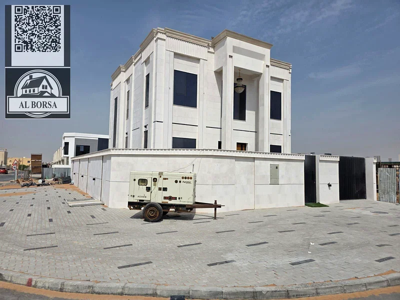 🏡 For sale, a corner villa in Al Helio 2, Ajman, 4 master bedrooms, a majlis, a hall, and all rooms are equipped with built-in wardrobes, at an attra63911300368897111
