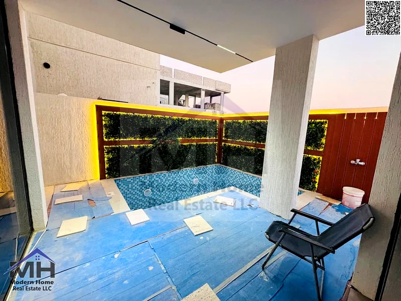 At a price that includes fees, electricity, central AC, own a villa with a roof and a pool, ready for occupancy in Ajman. first resident, freehold63884771528706114
