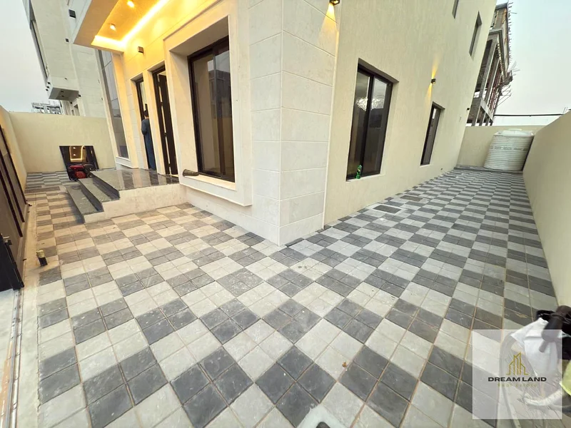 Villa for sale in Al Helio 2, Ajman, 5 master bedrooms with built-in wardrobes, a hall, two halls, and a spacious kitchen63912253672578113