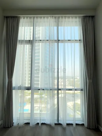 Elegant Floor-to-Ceiling Sheer and Blackout Curtains for a Bright Atmosphere