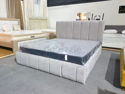 Stylish Grey Upholstered Bed with Modern Design