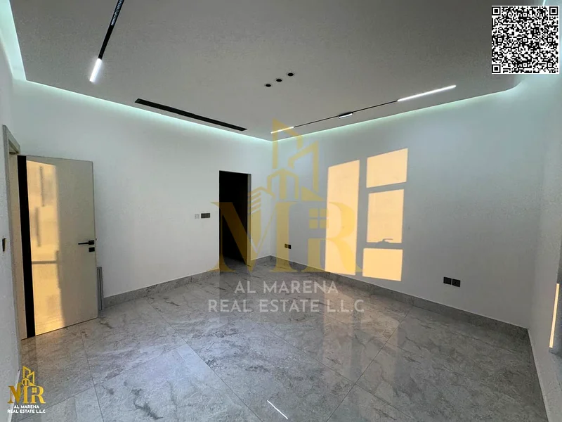 Luxury villa for sale in Al Bahia - Ajman | 2 floors + roof | 5 master bedrooms | Majlis + hall with sinks | Kitchen | Swimming pool | Price: AED 2,4563884375173505114