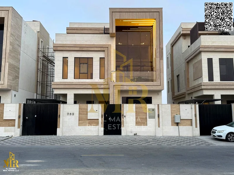 Luxury villa for sale in Al Bahia - Ajman | 2 floors + roof | 5 master bedrooms | Majlis + hall with sinks | Kitchen | Swimming pool | Price: AED 2,4563884375173505110