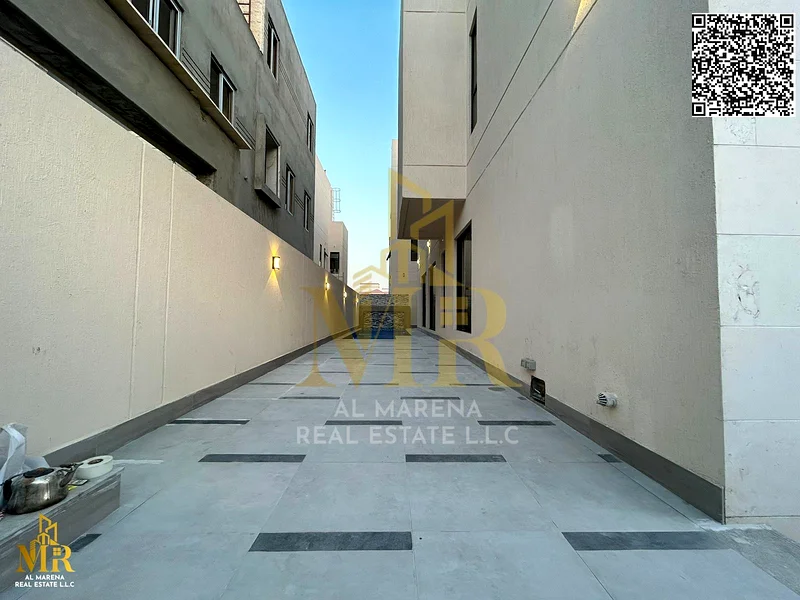 For sale, a luxury villa in Al Bahia with electricity, water, and air conditioning - Ajman | Two floors + roof | 5 master bedrooms | Majlis + hall | S63884375182594113