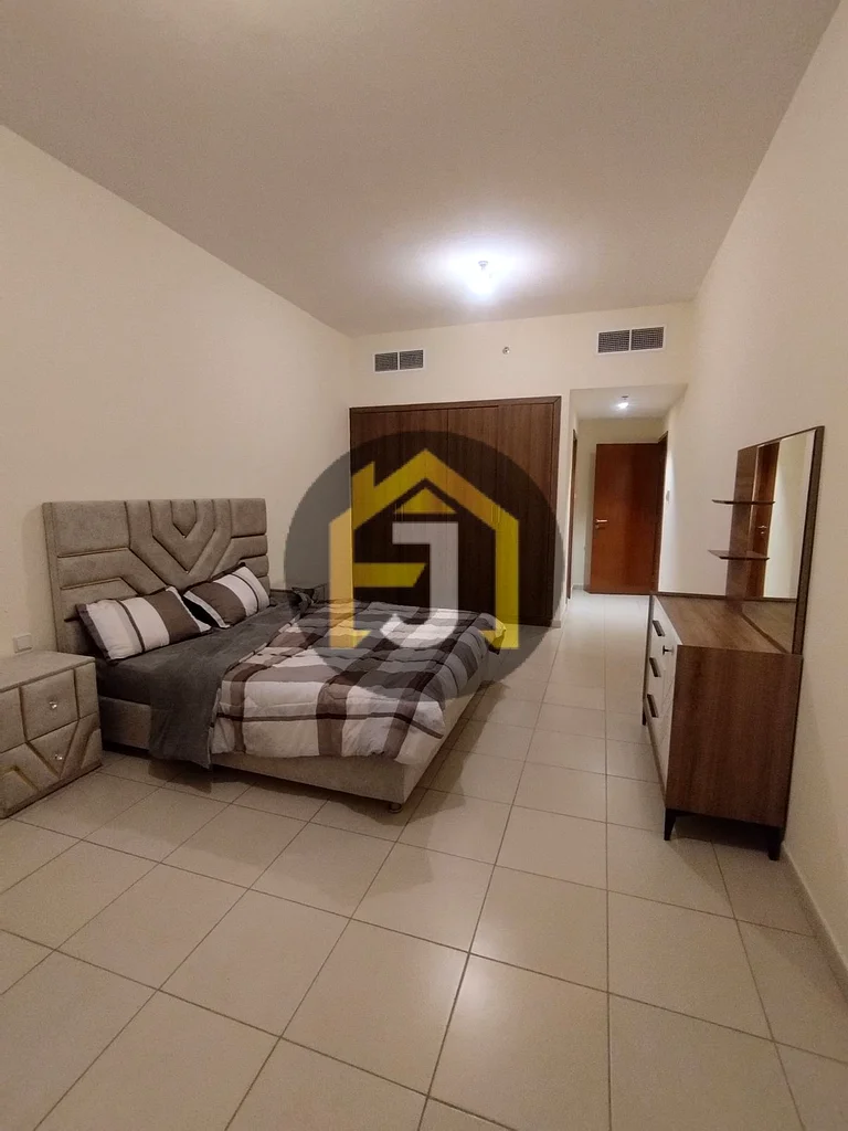 Two-bedroom apartment for sale in Ajman One Tower with city and garden view63866414183171111