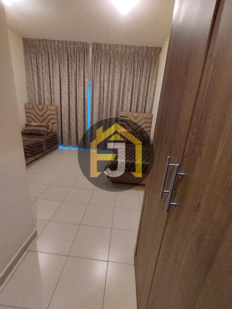 Two-bedroom apartment for sale in Ajman One Tower with city and garden view63866414183171112