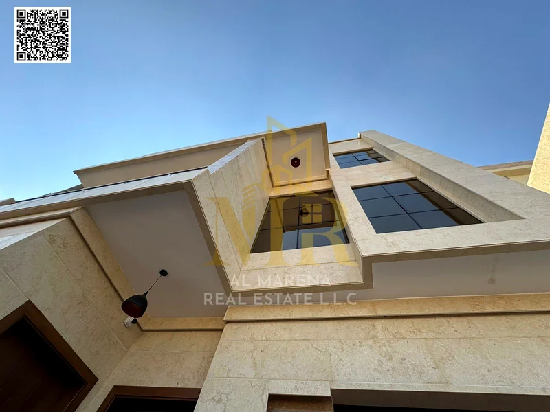 For sale - a spacious villa in Al Bahia Al Asoul - Ajman | Area 3014 square feet | Two floors + roof + courtyard | 6 master bedrooms | Majlis and hall63884375200770113