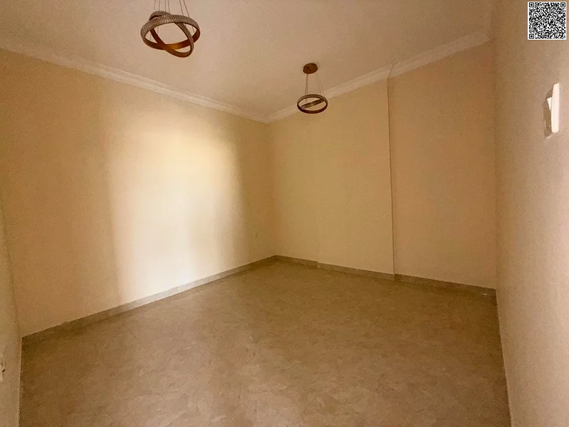 Free parking – Stunning 2BR hall in Al Rawda – Spacious rooms & large kitchen – 2 baths – Central AC – Stylish finish – Prime location.64053302081154113