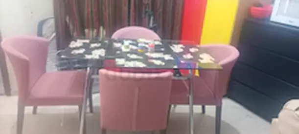 Stylish 4-Seater Dining Table with Pink Chairs