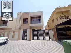 For rent a villa in Al Yasmeen, Ajman, 5 master bedrooms, a living room, a hall, and a maid's ro
