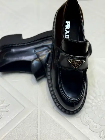 Prada womens super master black leather loafers
