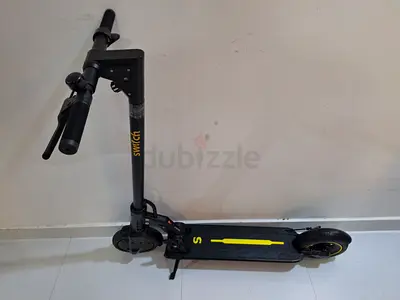 SWITCH-Electric Scooter, used 4 hours only, invoice attached, with original battery and charger !!!
