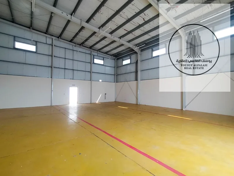 Warehouse with a fence for rent in Al Sajaa Industrial City - prime location, area of ​​10,000 square feet64057583513474111