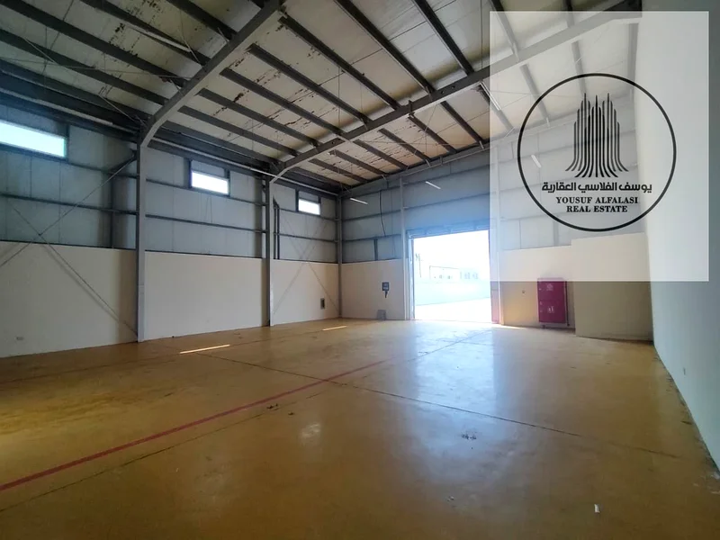 Warehouse with a fence for rent in Al Sajaa Industrial City - prime location, area of ​​10,000 square feet64057583513474113