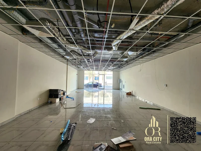 For annual rent, a 1250 sq ft shop in Ajman, behind the Chinese market, with an internal office and bathroom, in a vital location near the exits of Du64073895126402113