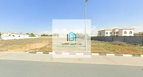 Two Adjacent Residential Plots in Sharjah – Muzairah Prime Location on a 36-meter-wide main road